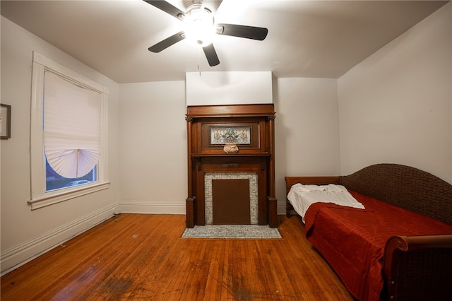 bedroom with hardwood / wood-style floors and ceiling fan