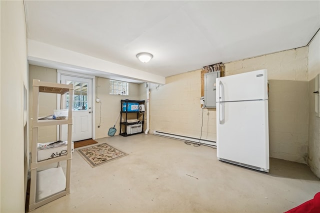 basement with white fridge and baseboard heating