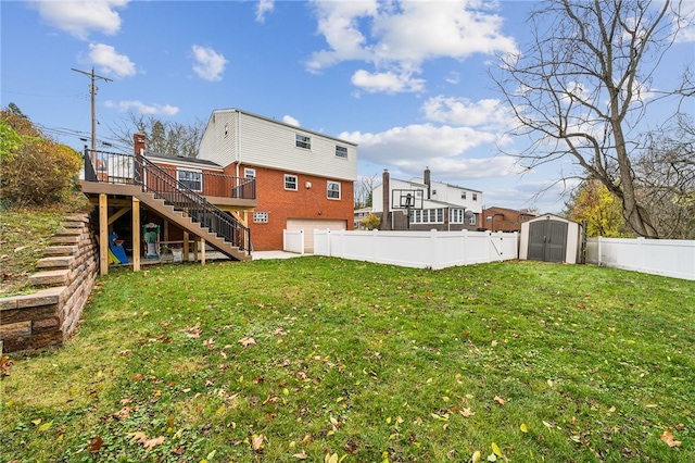 view of yard featuring a storage unit and a deck