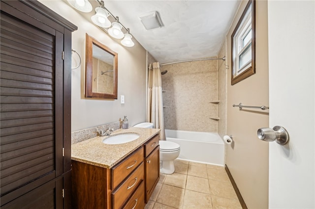 full bathroom with tile patterned floors, shower / bath combo with shower curtain, vanity, and toilet