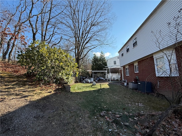 view of yard with central AC