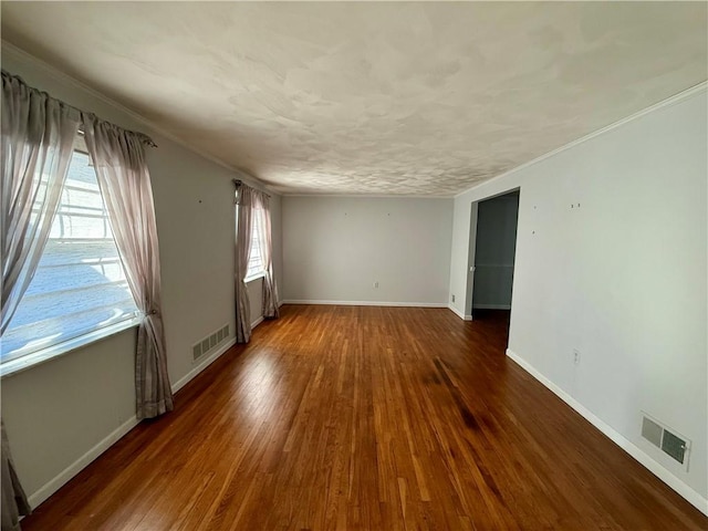 unfurnished room featuring dark hardwood / wood-style floors