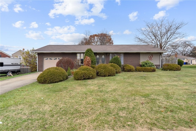 627 Wayne Ave, Monaca, PA 15061 - ranch-style home with brick siding, a garage, driveway, and a front lawn