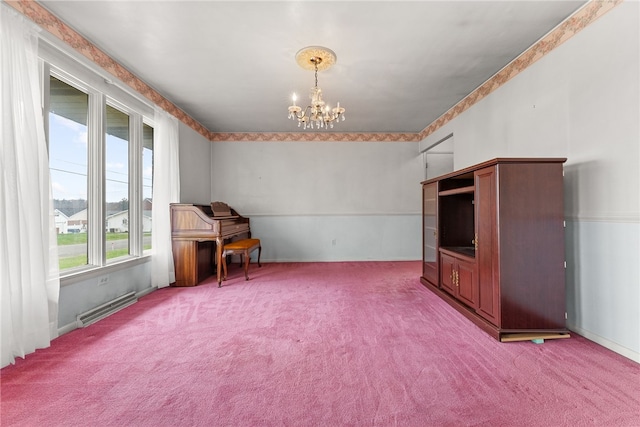 misc room featuring carpet flooring and a notable chandelier