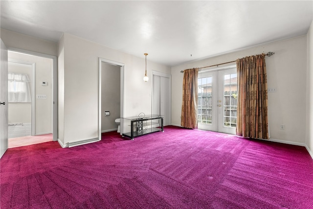 carpeted empty room with french doors