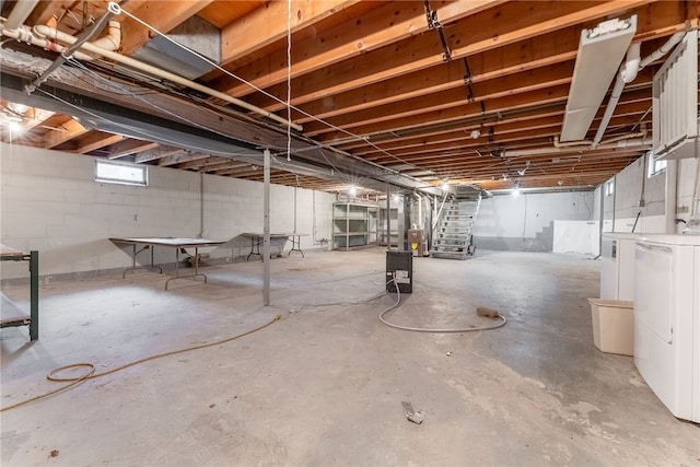 basement with washing machine and clothes dryer