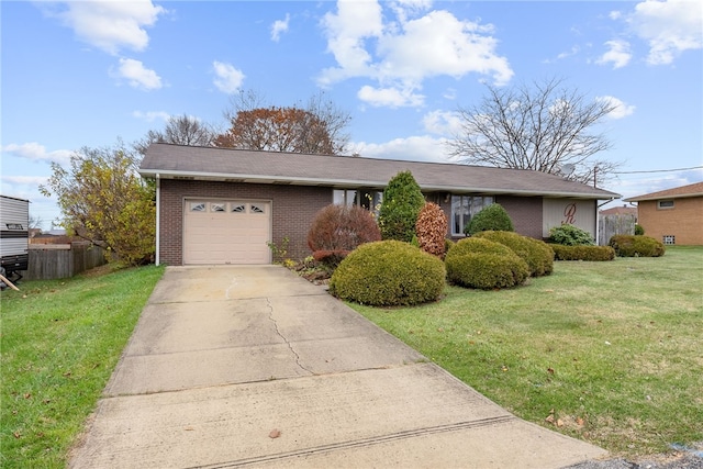 single story home featuring a front lawn and a garage