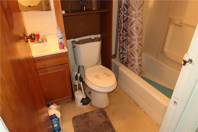 full bathroom featuring vanity, toilet, and shower / tub combo