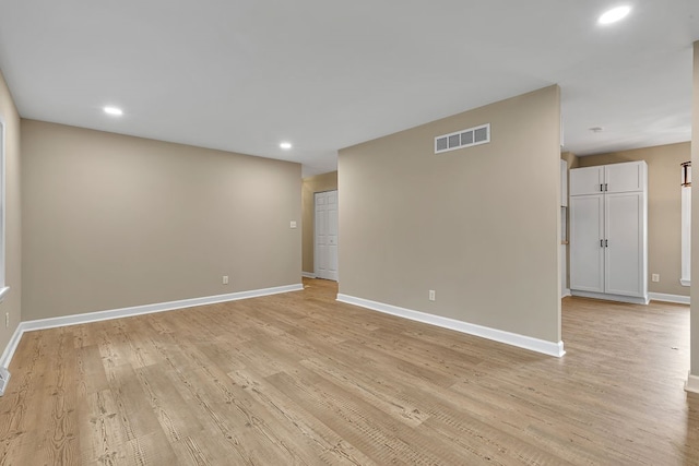 unfurnished room with light hardwood / wood-style flooring