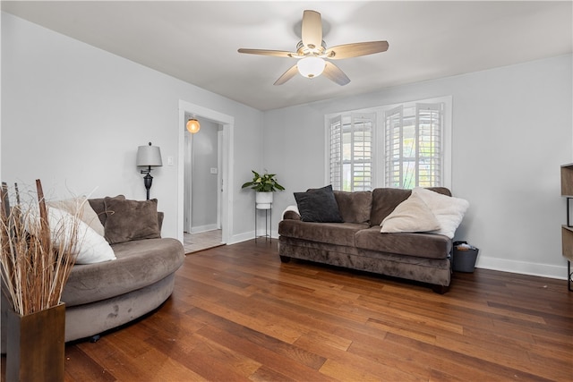 living room with ceiling fan and hardwood / wood-style flooring