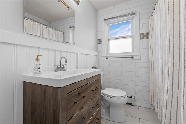 bathroom with vanity, a baseboard radiator, and toilet