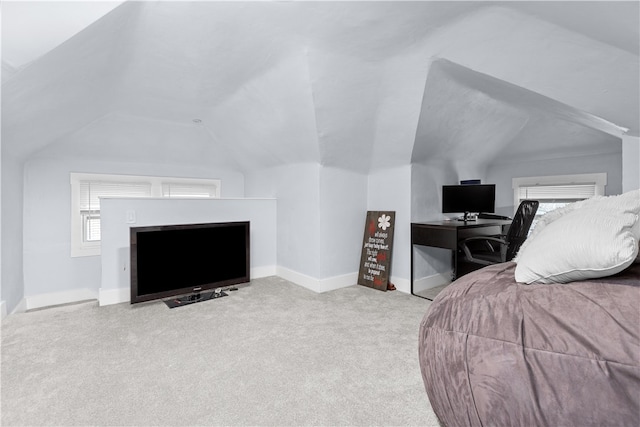 carpeted bedroom featuring vaulted ceiling