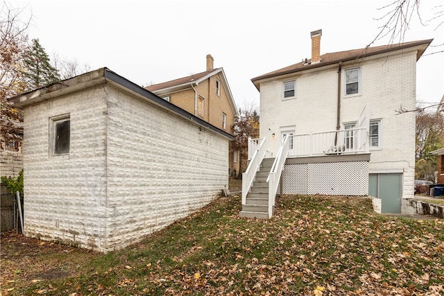 back of property with a wooden deck