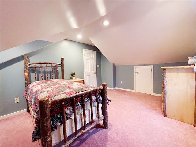 bedroom featuring carpet flooring and lofted ceiling