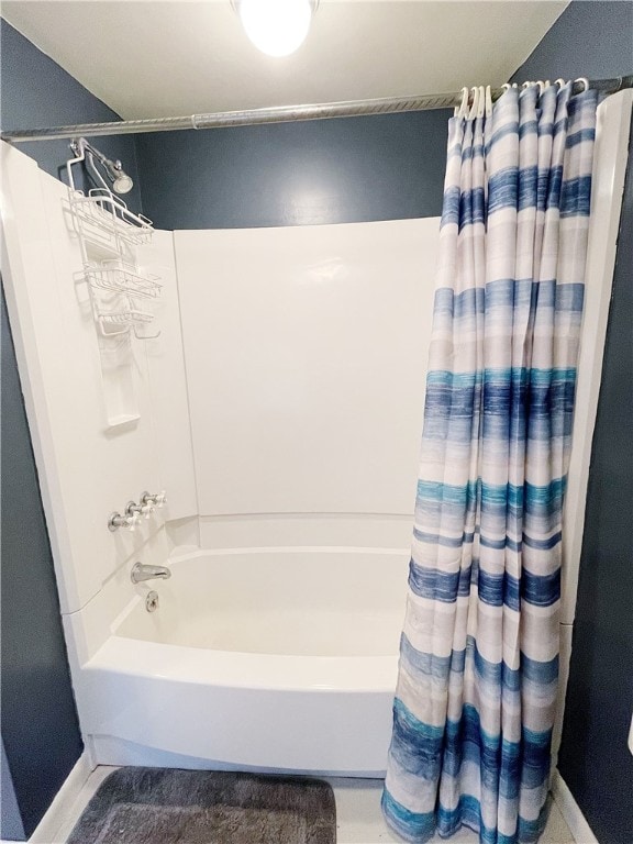 bathroom featuring shower / tub combo with curtain