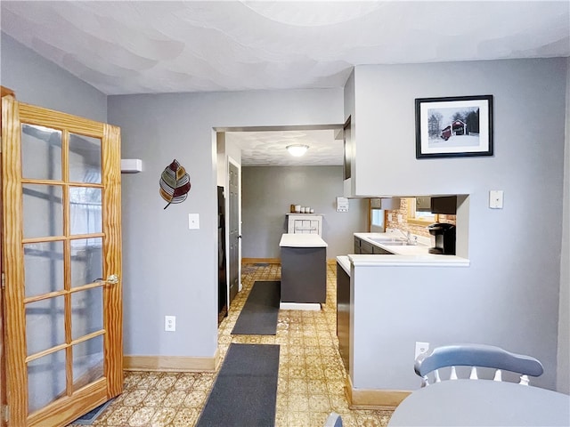 interior space featuring sink and a textured ceiling