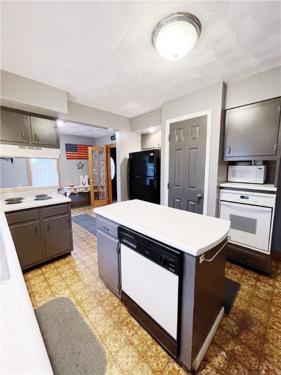 kitchen featuring a center island and white appliances