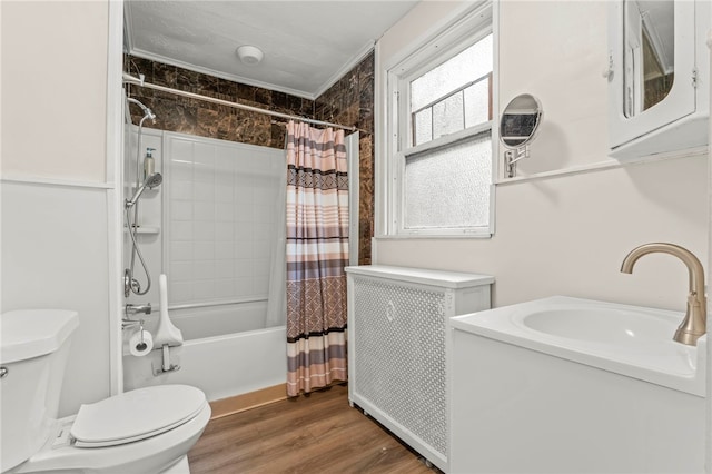 full bathroom with radiator, shower / bath combination with curtain, hardwood / wood-style flooring, toilet, and crown molding