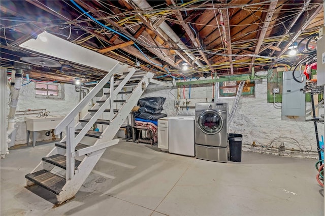 basement featuring sink and independent washer and dryer