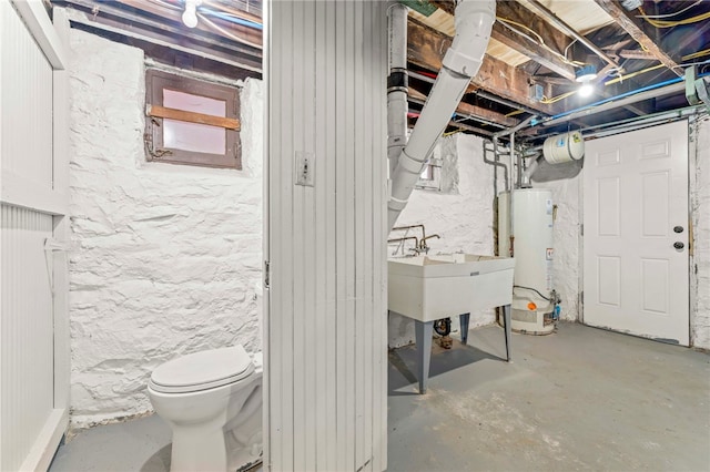 basement featuring gas water heater and sink