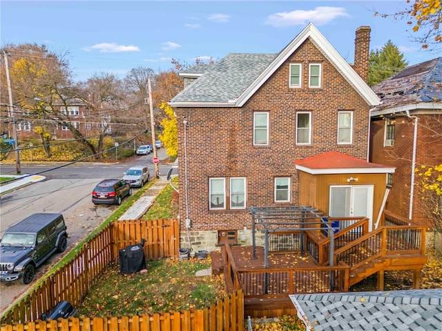 rear view of house with a deck