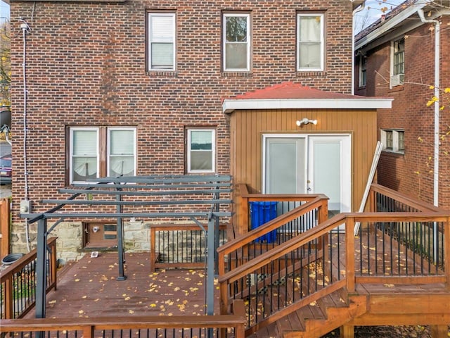 back of house with a wooden deck