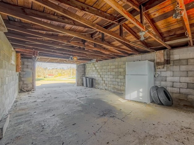 garage with white fridge