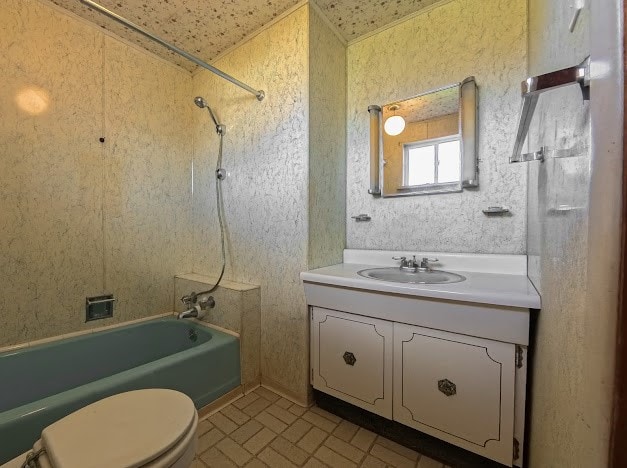 full bathroom featuring bathtub / shower combination, vanity, and toilet