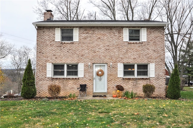 view of property featuring a front yard