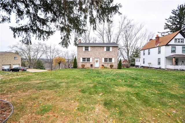 rear view of house with a lawn