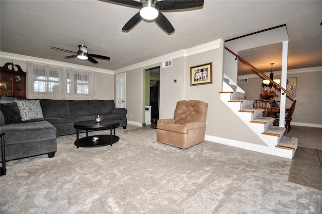 living room featuring ceiling fan with notable chandelier, carpet floors, and ornamental molding