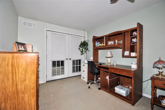 home office featuring light colored carpet and ceiling fan