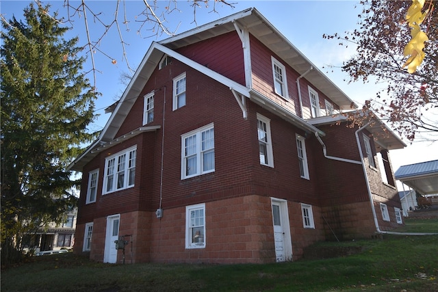 view of home's exterior with a yard