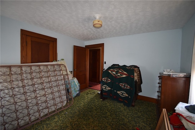 carpeted bedroom with a textured ceiling