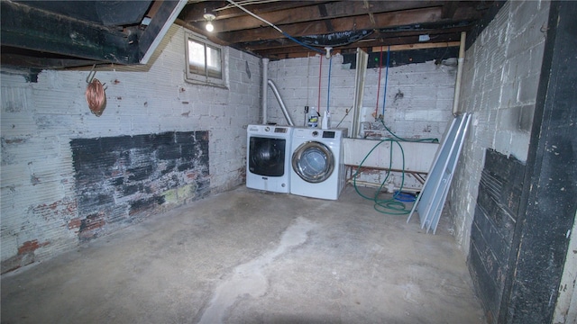 basement with washer and clothes dryer