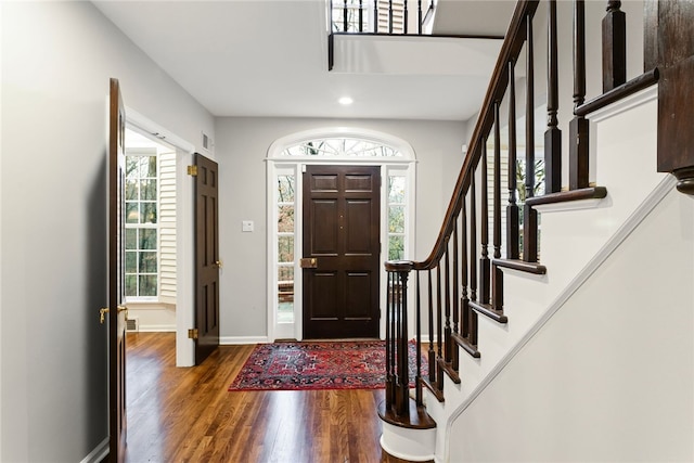 entrance foyer featuring dark hardwood / wood-style flooring