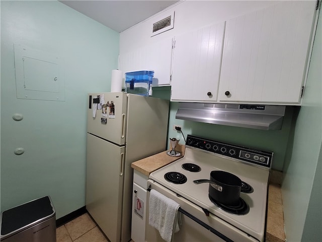 kitchen featuring white cabinets, light tile patterned flooring, white appliances, and ventilation hood