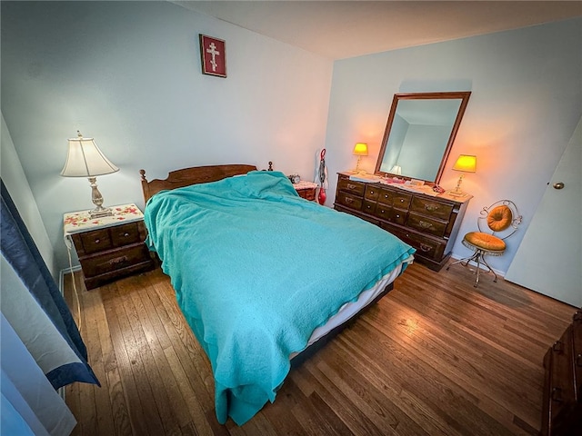 bedroom featuring dark hardwood / wood-style flooring