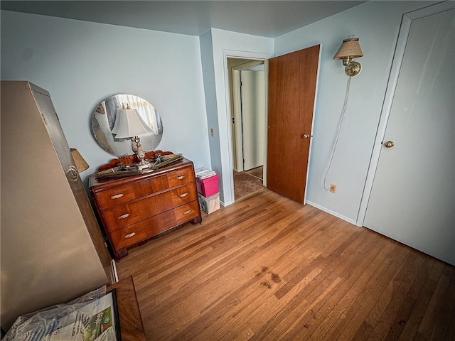 bedroom with light hardwood / wood-style floors