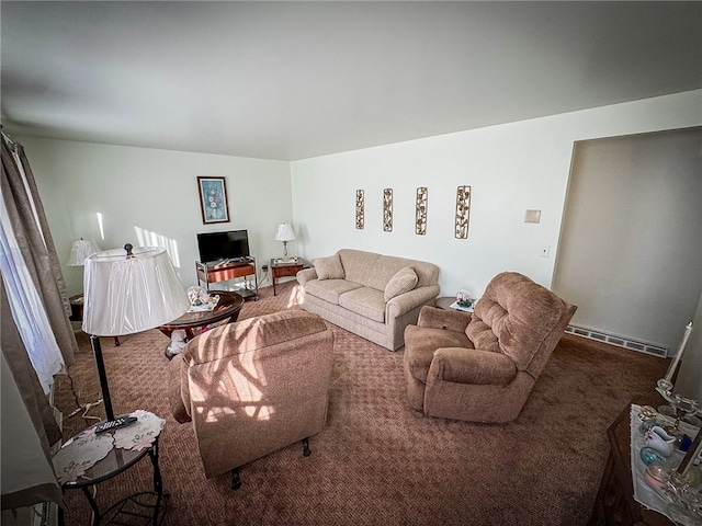 living room featuring dark colored carpet and a baseboard heating unit