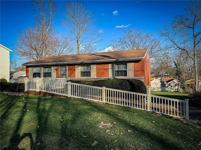 single story home with a front yard