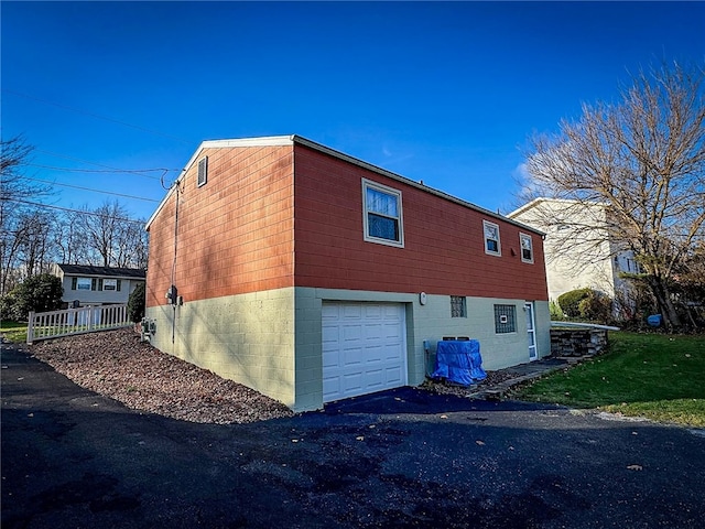 view of home's exterior with a garage