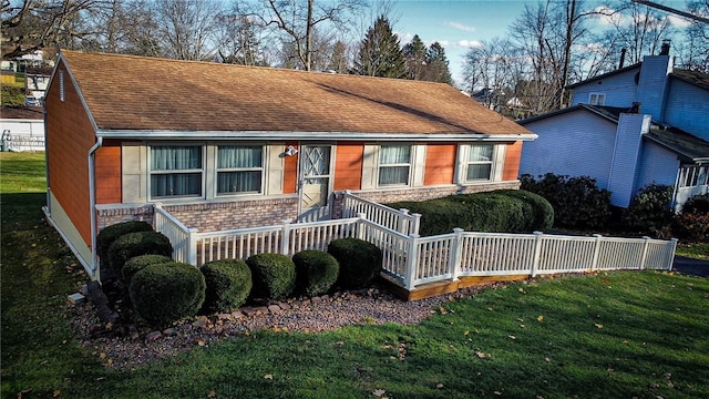 view of front of home with a front lawn