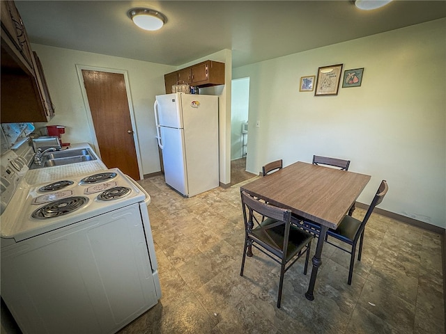 kitchen featuring sink and white appliances