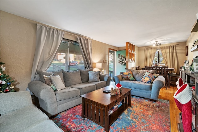 living room featuring plenty of natural light and wood-type flooring