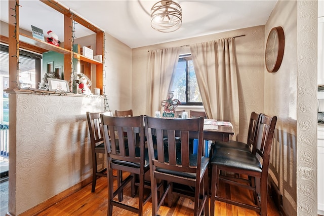 dining room with hardwood / wood-style floors