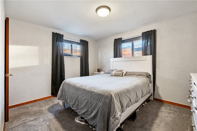 bedroom featuring carpet and multiple windows