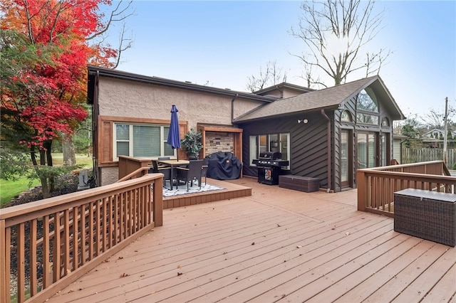 wooden terrace with area for grilling