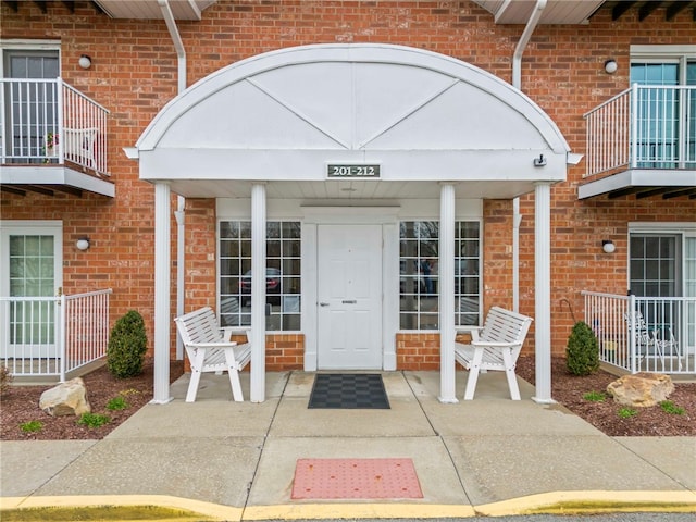 entrance to property featuring a patio area