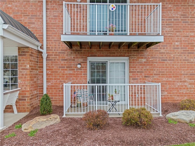 doorway to property featuring a balcony